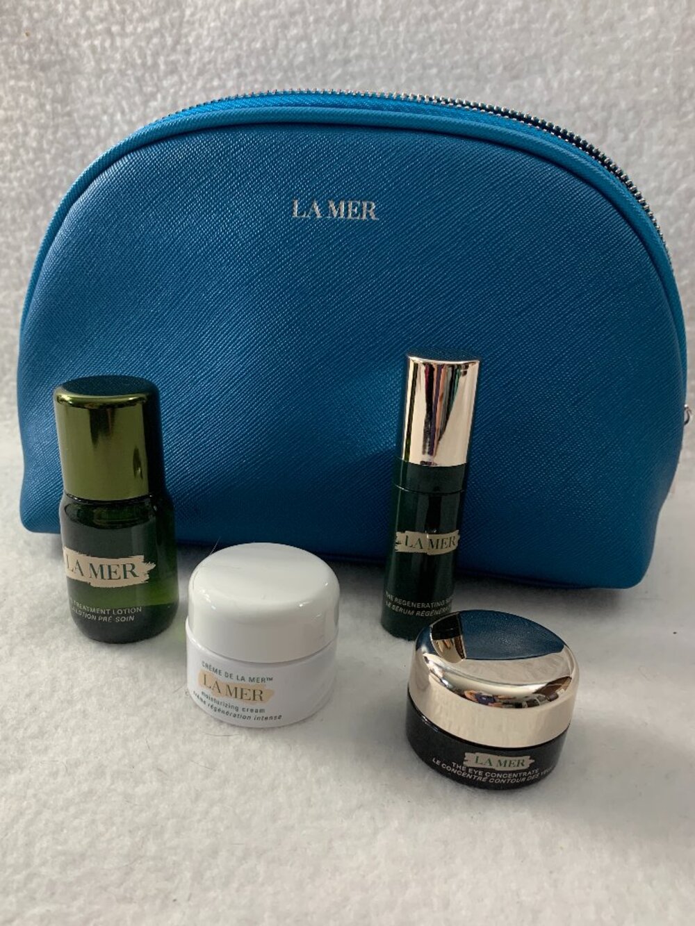 La Mer 4 Piece Skincare Travel Set with a Blue Travel Pouch